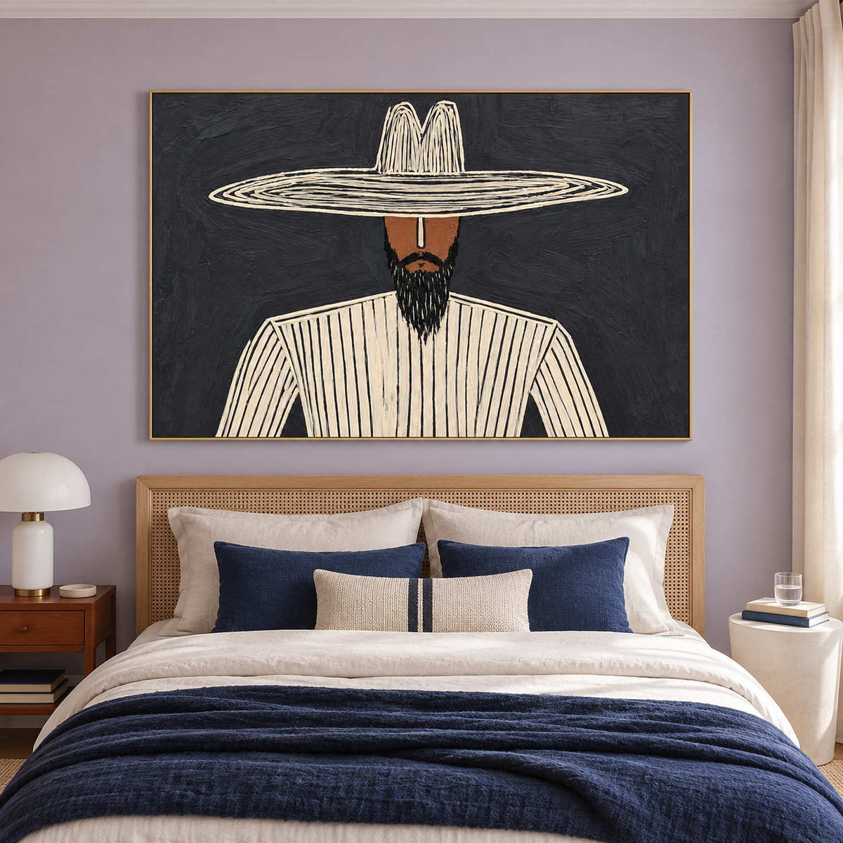 Bearded figure artwork over a woven headboard and navy bedding on a lavender wall.