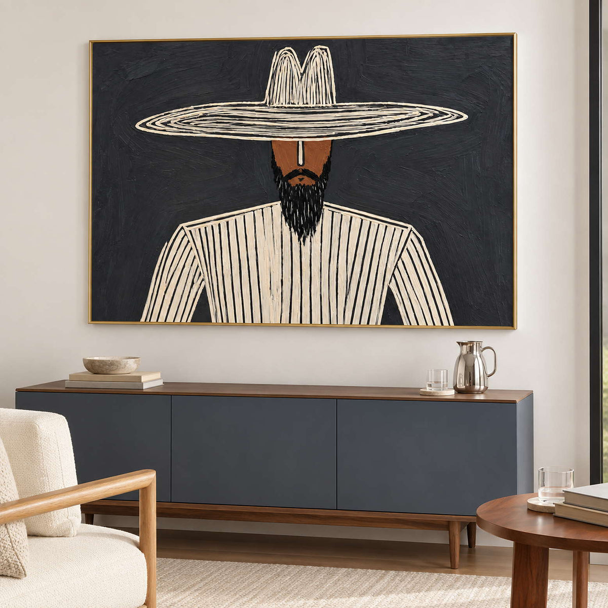 Bearded portrait above a blue-gray sideboard with a pitcher and stacked books.