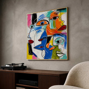 Bold pop-art faces displayed in a cool gray listening room.