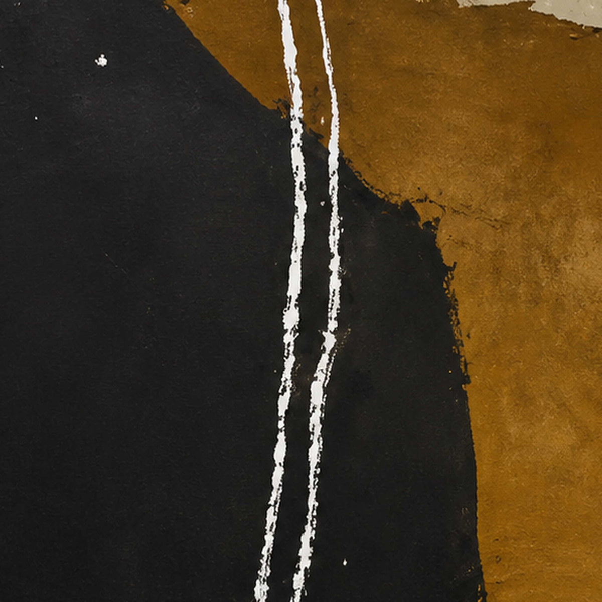 Close view of uneven white lines crossing matte black and ochre painted areas.