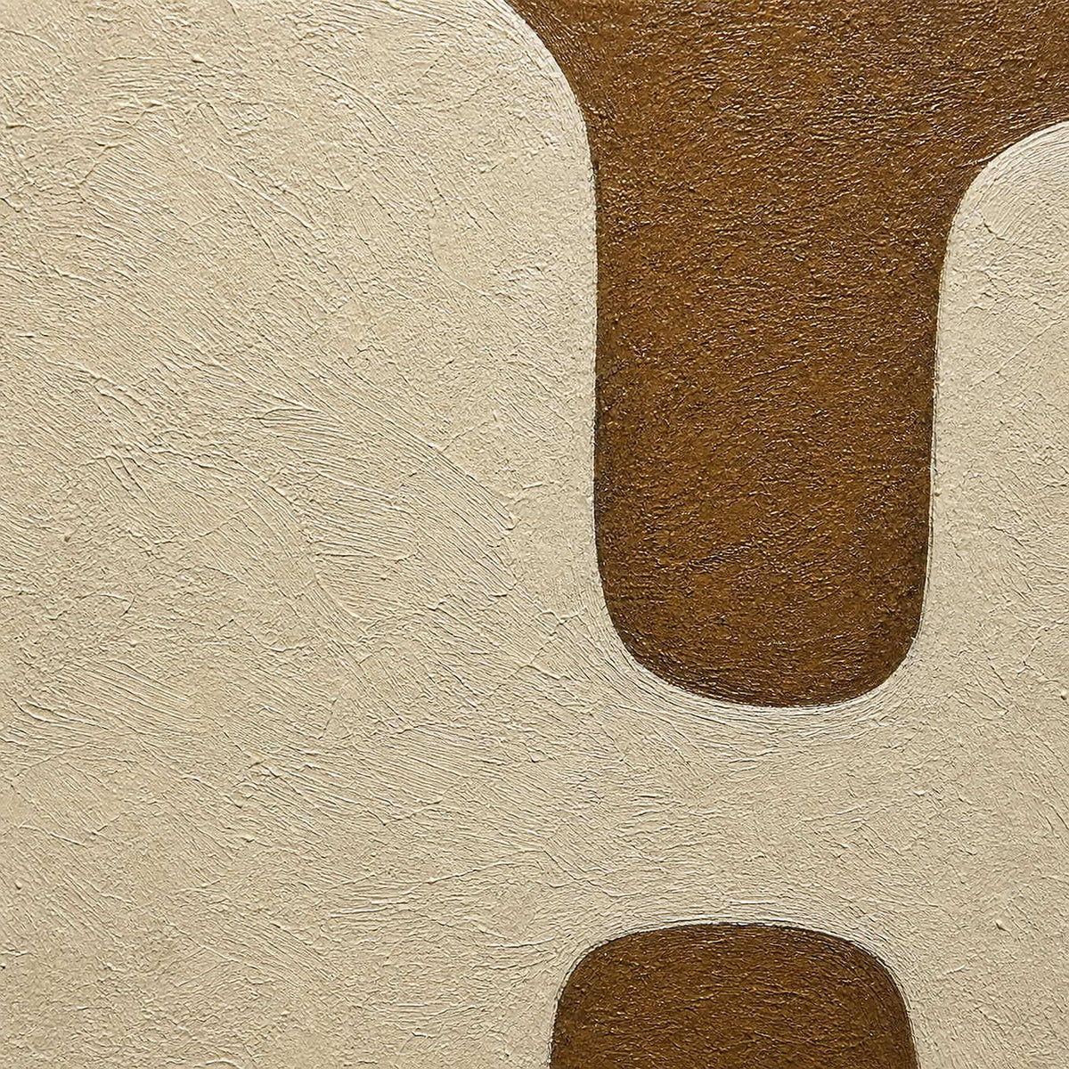 Detail of Facing Each Other, showing the ivory forms and textured brown ground.