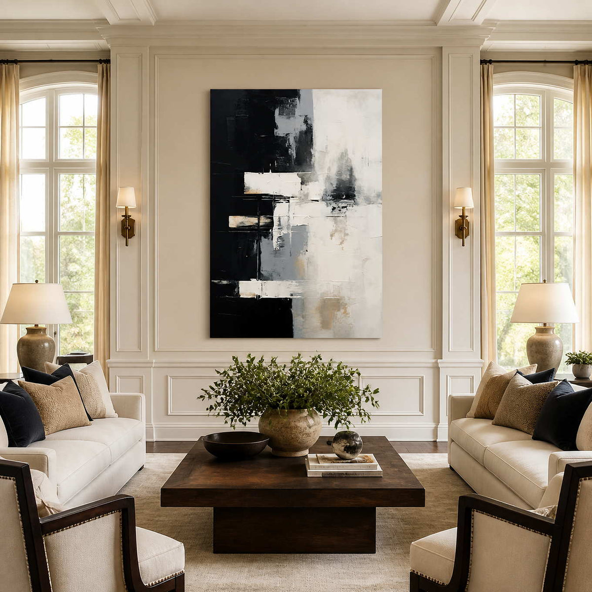 Frameless black and white abstract artwork between tall windows in a bright living room.