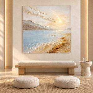 Coastal painting with pale blue water, golden sand, and distant hills without an outer frame in a meditation room.