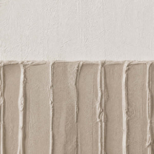 Close-up of vertical gray-beige relief grooves against warm white texture.