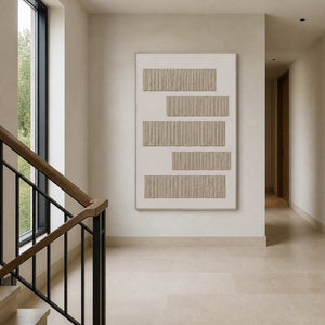 Wabi-sabi wall art viewed from a pale stone stair landing.