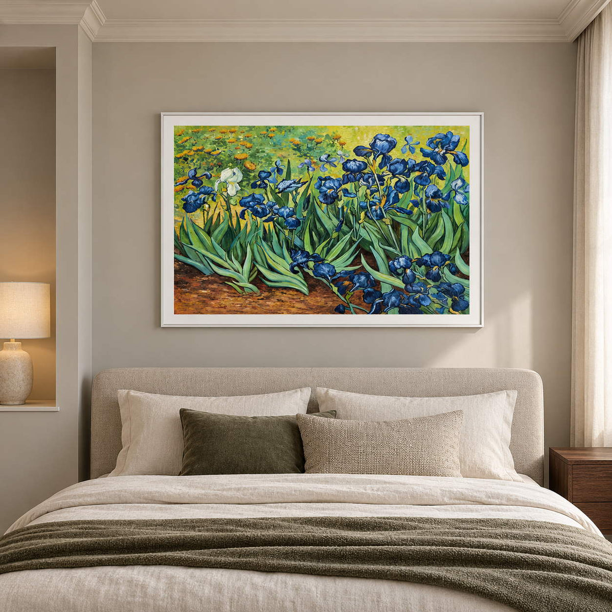 Artwork showing blue flowers and curling green leaves above warm brown soil in a bedroom near the bed, with a white frame.