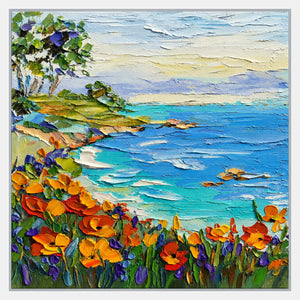 Orange and purple flowers border a turquoise bay with rocks, trees on the left shore, and a pale layered sky.