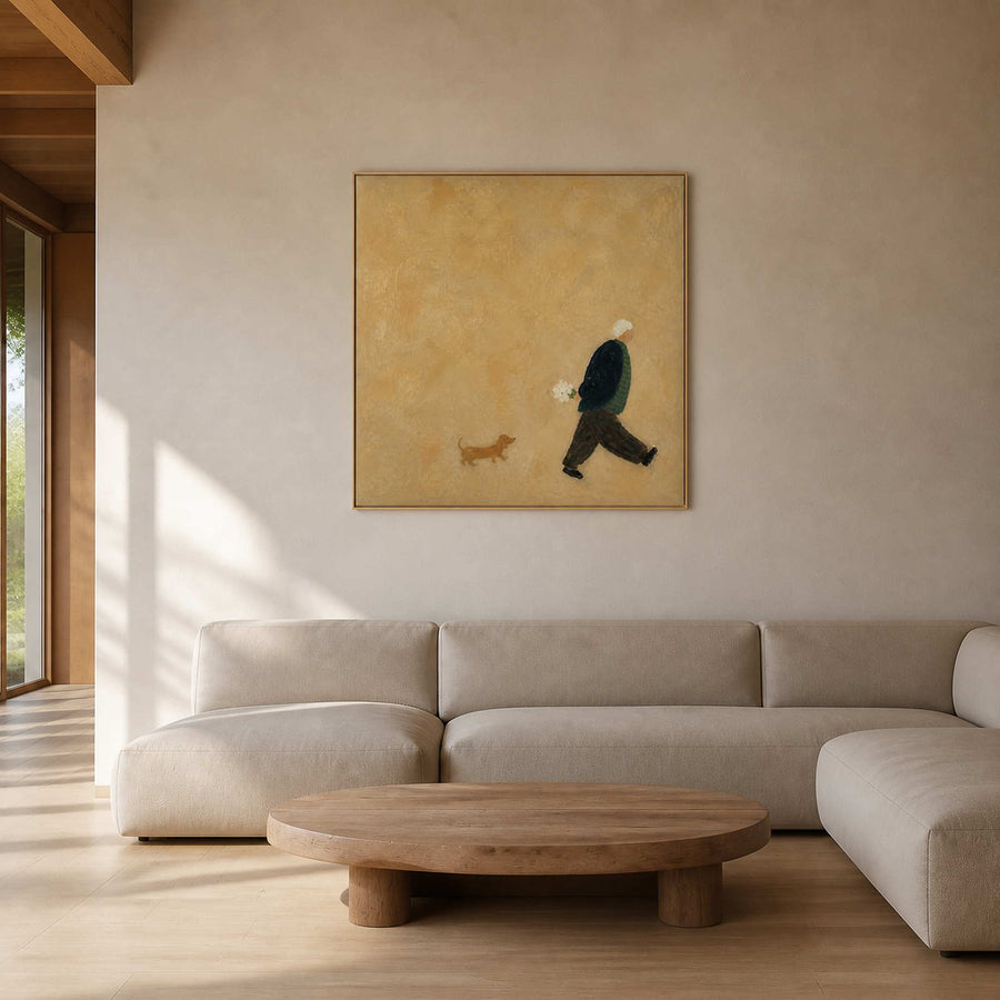 Textured figurative wall art with a walker and dachshund in a warm living room.