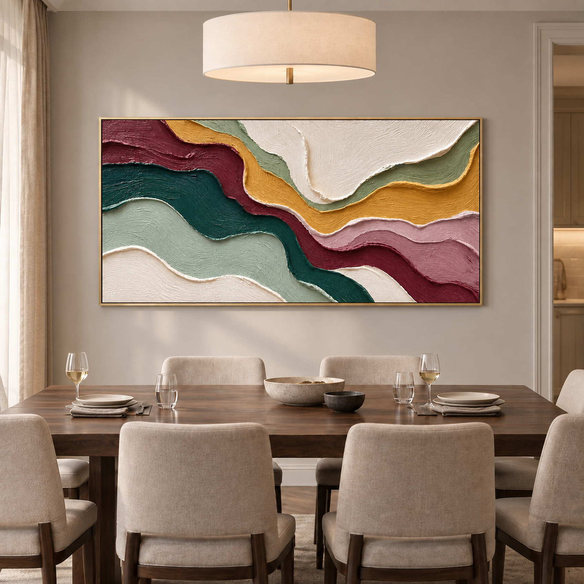 Wavy multicolor abstract over a wooden dining table beneath a wide cream pendant.
