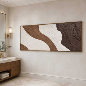 Wood-framed panoramic abstract wall art beside a bathroom vanity with a marble counter.