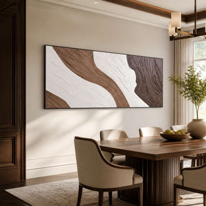 Black-framed flowing abstract wall art beside a wooden dining table and upholstered chairs.