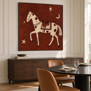 Spotted horse painting above a sideboard beside a dark dining table.
