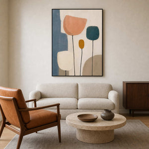 Minimalist floral wall art in a warm mid-century living room.