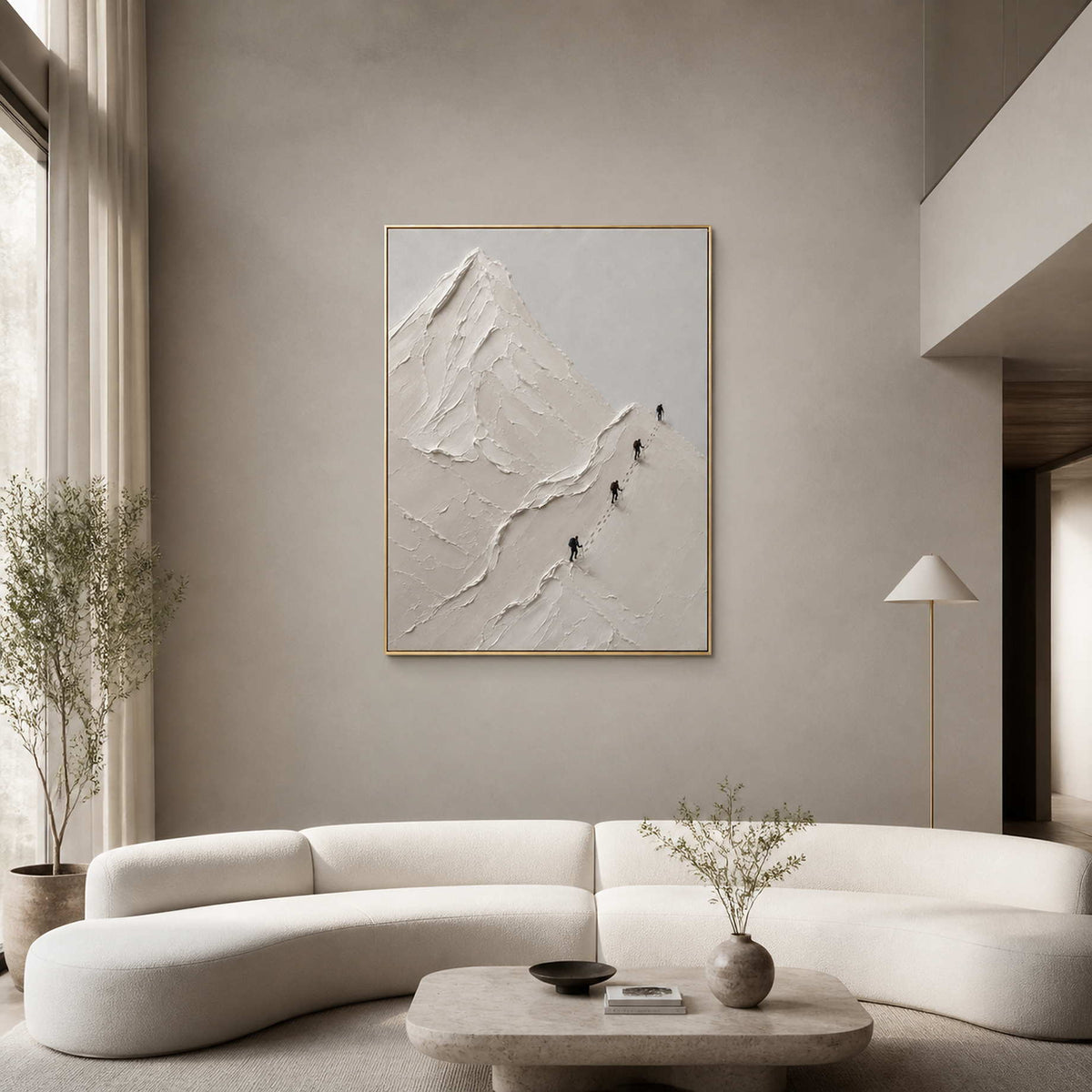 Textured white mountain wall art displayed in a warm double-height living room.