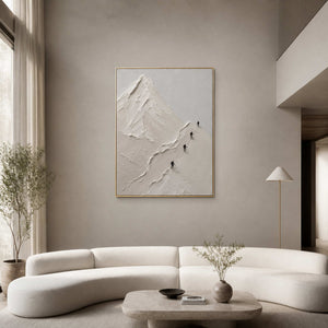 Textured white mountain wall art displayed in a warm double-height living room.