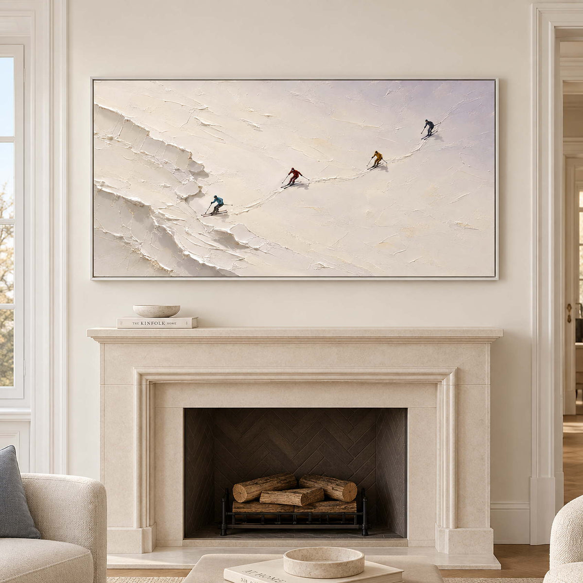 Four skiers crossing an open ivory-white slope in a white frame, displayed above a fireplace.