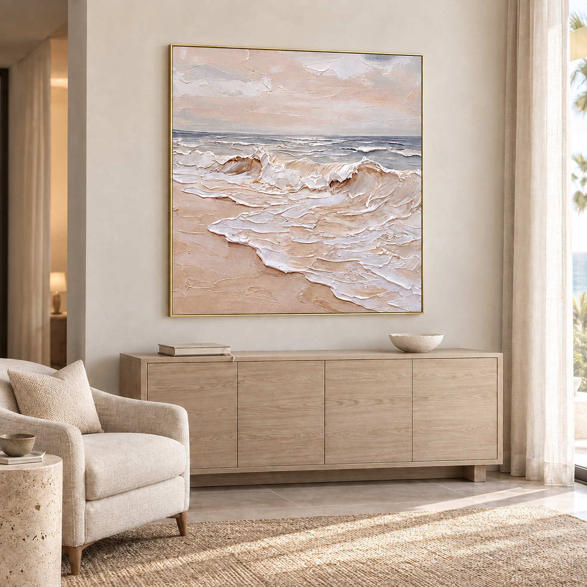 Free as the Sea in a gold frame above a pale wood sideboard beside a cream armchair in a commercial lounge.