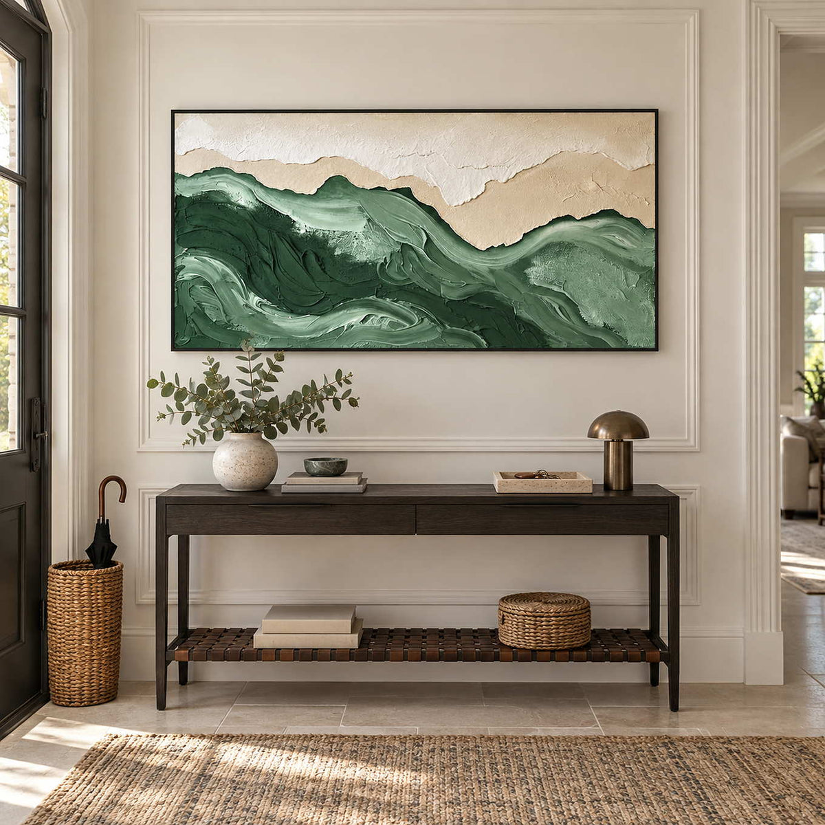 Free to Wander in a black frame above a dark hallway console with greenery, a brass lamp and woven storage.