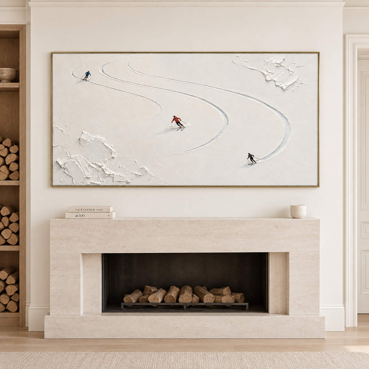 Three skiers tracing curved tracks through fresh white snow in a gold frame, displayed above a fireplace.