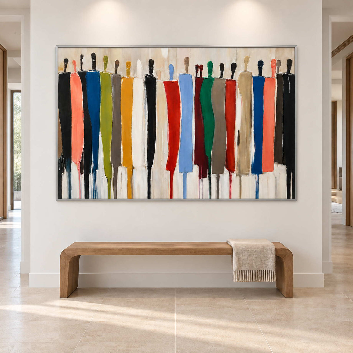 Wide abstract figure artwork above a simple wood bench in a bright entryway.