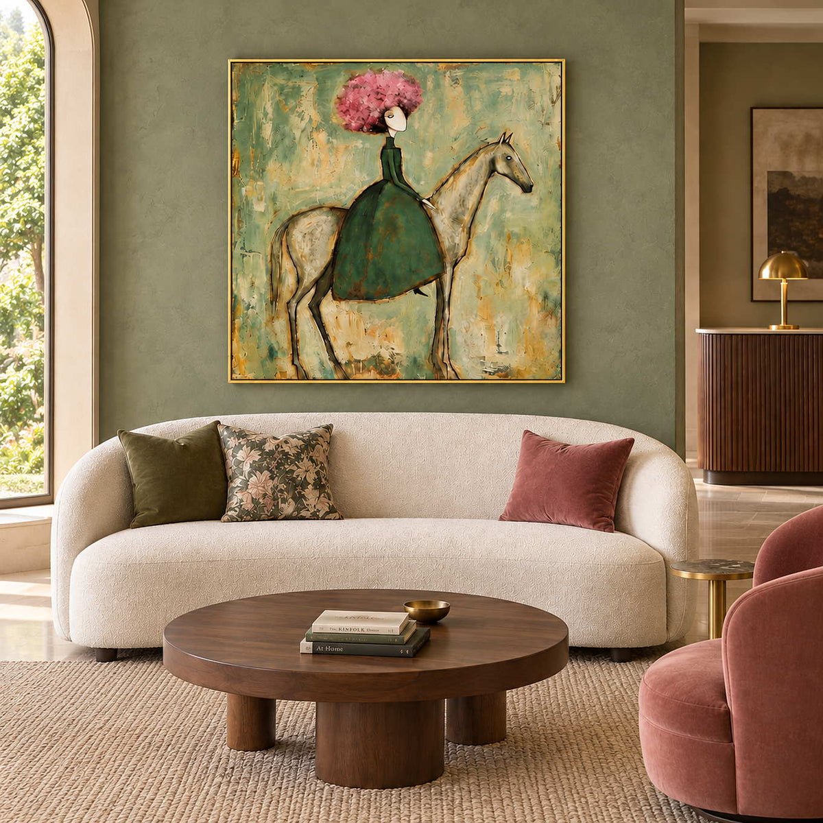 Gentle Company in a gold frame above a curved cream sofa with pink and green cushions in a commercial lobby.