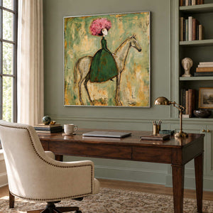 Gentle Company in a silver frame above a wood desk and cream chair against sage wall paneling.