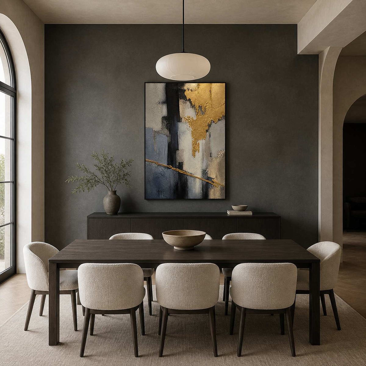 Textured gold abstract painting displayed in a charcoal dining room.