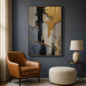 Gold and slate abstract painting displayed in a blue-gray reading room.