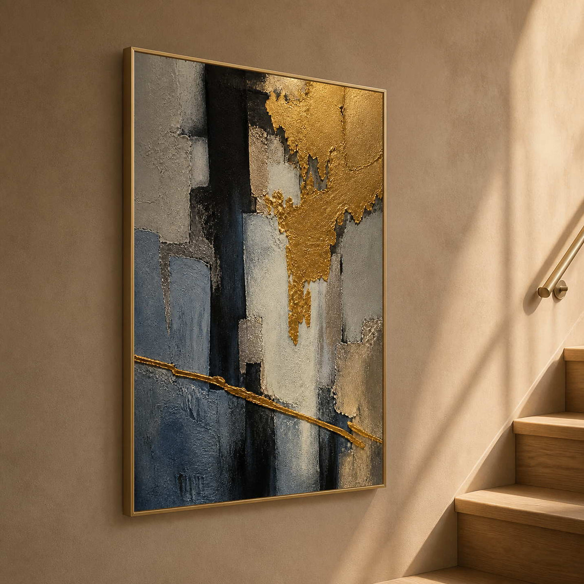 Vertical gold and charcoal artwork displayed beside a warm wood stairway.