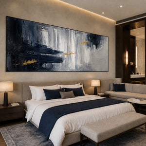 Textured abstract wall art displayed in a refined boutique hotel suite.