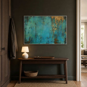 Gold and turquoise abstract art contrasts with a dark entryway.