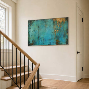 Horizontal turquoise wall art brightens a residential stair landing.