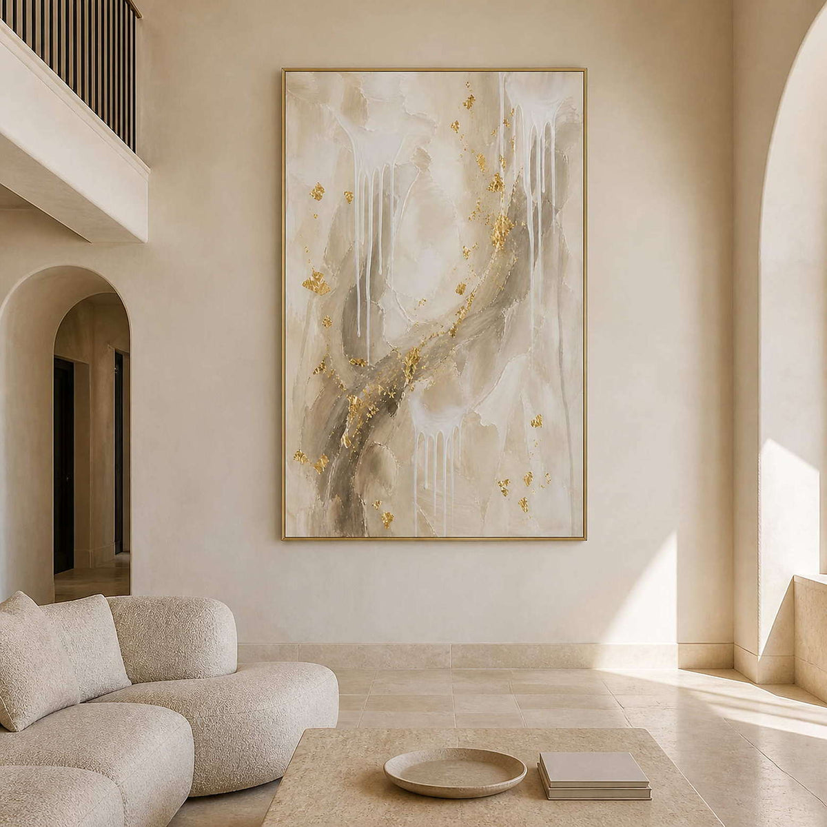 Ivory and gold textured abstract wall art in a bright living room.