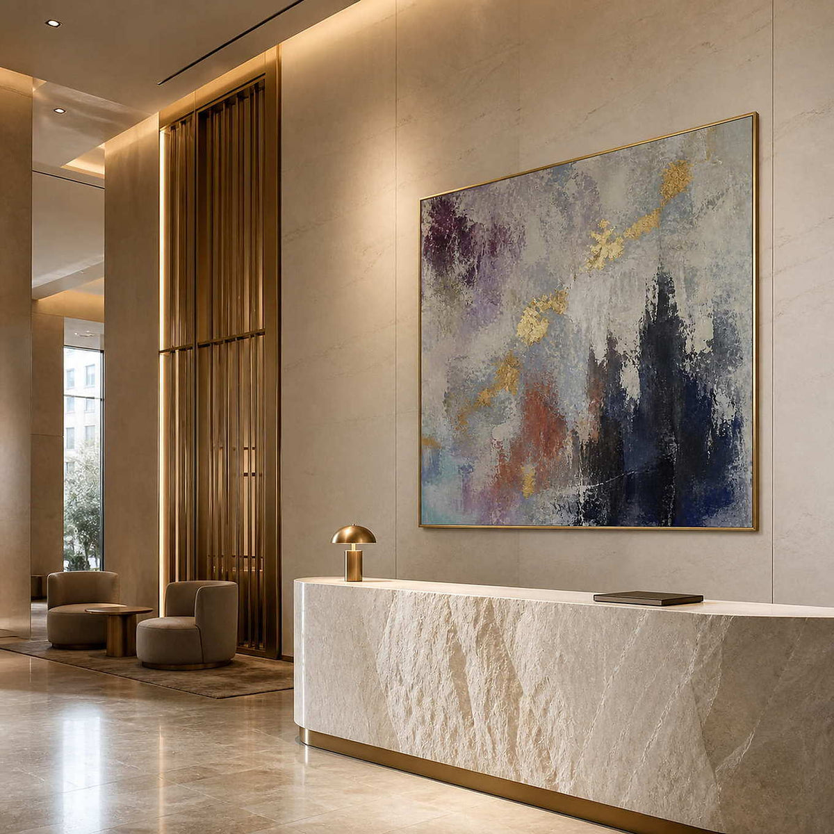 Gold-accented abstract painting in an ivory boutique hotel reception.