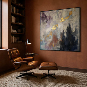 Deep blue and gold abstract canvas in a rust reading room.