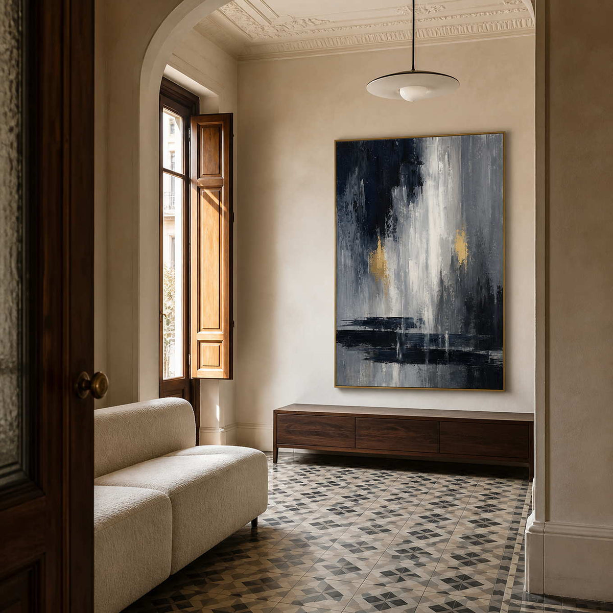 Textured grey and gold wall art displayed in an elegant entryway.