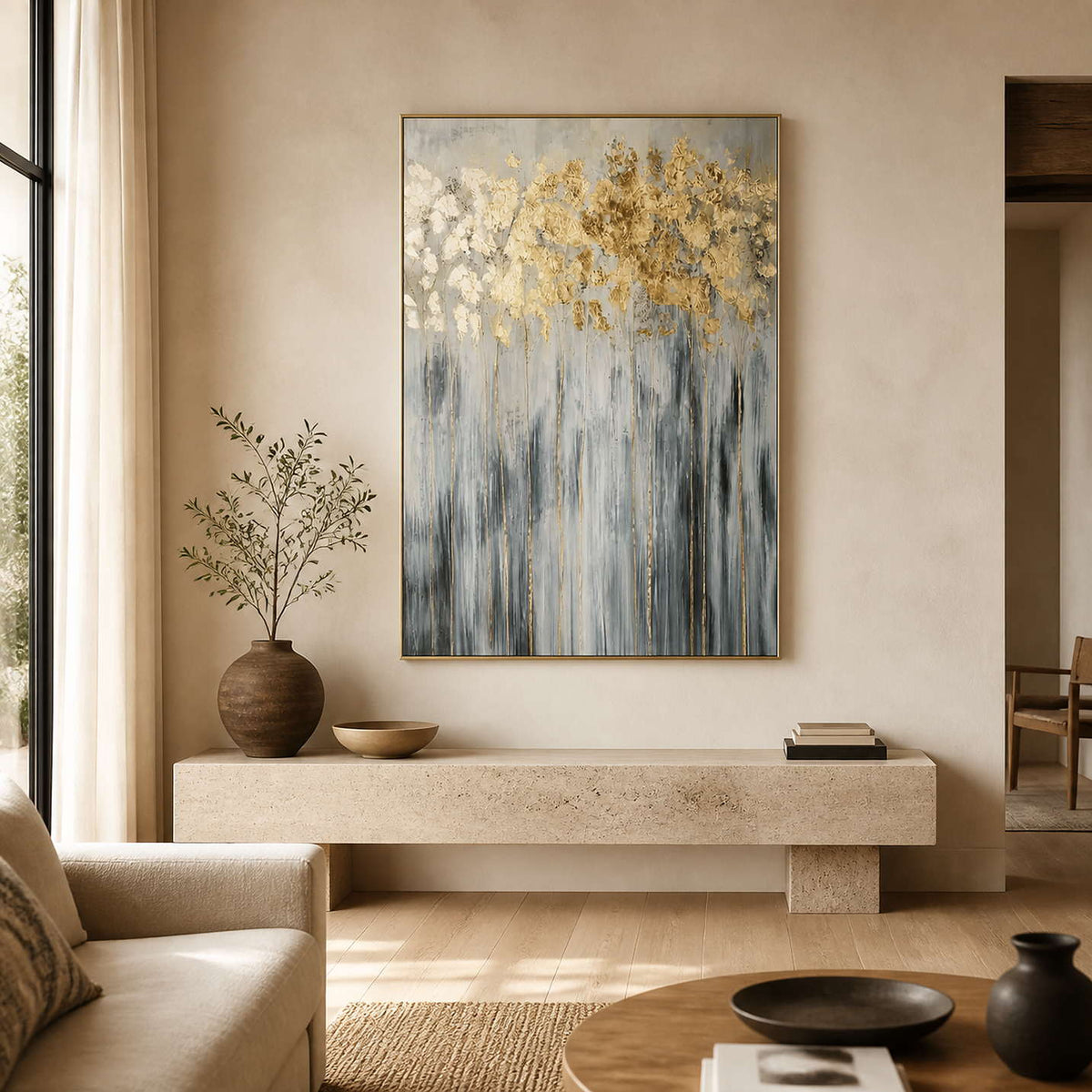 Gold and gray textured botanical wall art displayed in a warm modern living room.