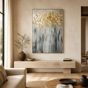 Gold and gray textured botanical wall art displayed in a warm modern living room.