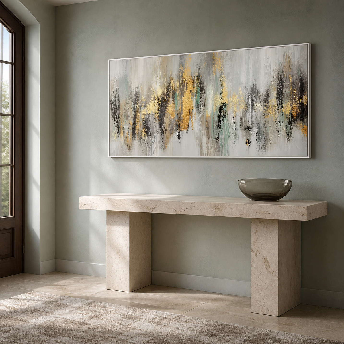 Wide abstract artwork displayed above a pale stone entryway console.