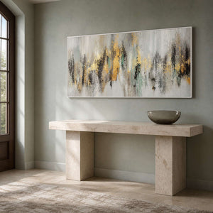 Wide abstract artwork displayed above a pale stone entryway console.