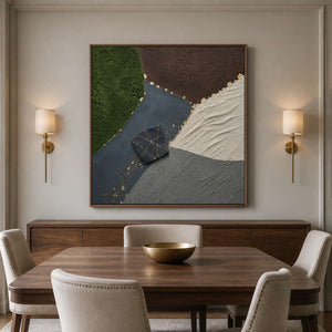 Earth tone abstract wall art in a wood frame beside dining furniture.