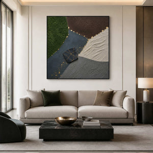 Green and black abstract wall art above a neutral modern living room sofa.