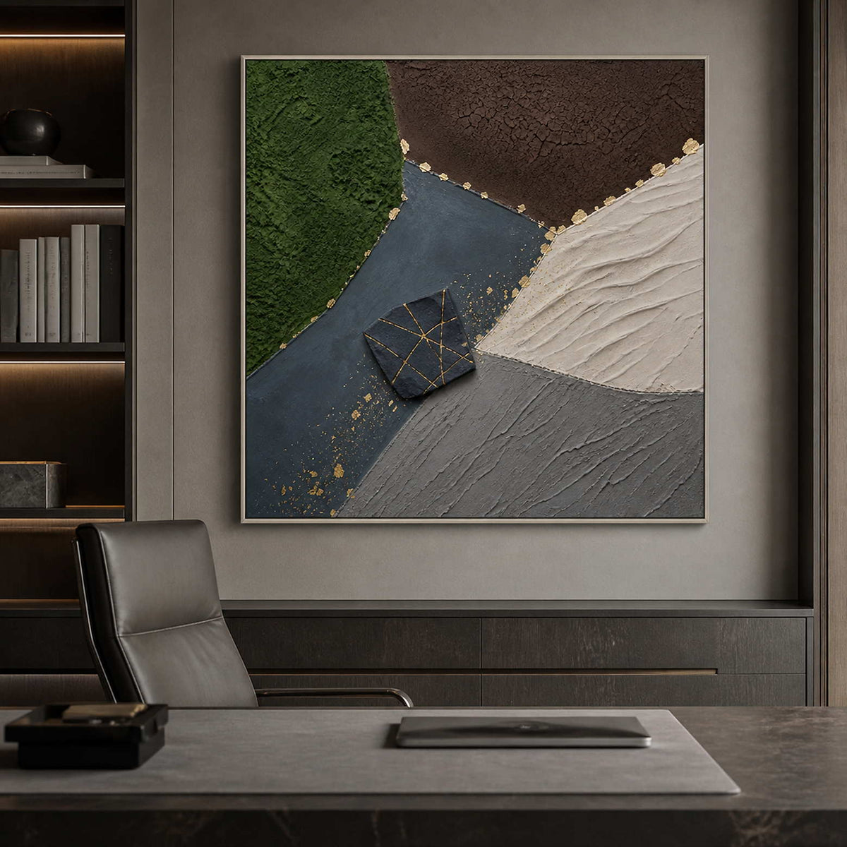Textured green and black artwork in a silver frame inside an office.