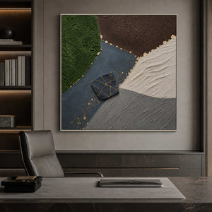 Textured green and black artwork in a silver frame inside an office.