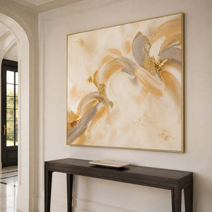 Textured gold and cream artwork in an elegant residential entryway.