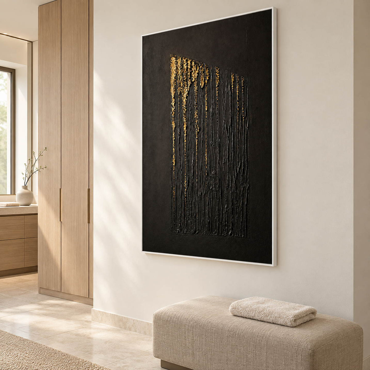 Hand-painted vertical abstract canvas with carved black ridges and gold relief, displayed in a bathroom dry area in a white frame.