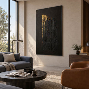Hand-painted vertical abstract canvas with carved black ridges and gold relief, displayed in a club lounge in a black frame.