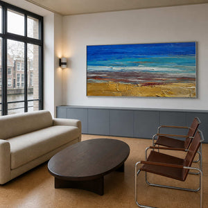 Panoramic ocean wall art displayed in a bright modern family room.