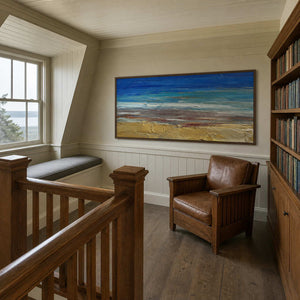 Ocean wall art displayed in a coastal stair library with wood details.