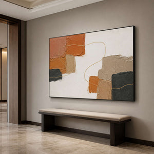 Textured earth tone wall art displayed above a hallway bench.
